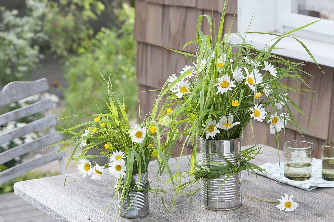 Meadow bouquets of grasses, leucanthemum and ranunculus