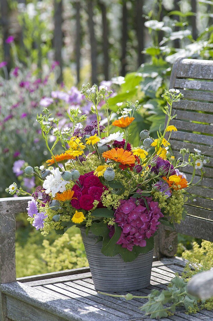 Variegated bouquet of pink (rose), calendula (marigold)