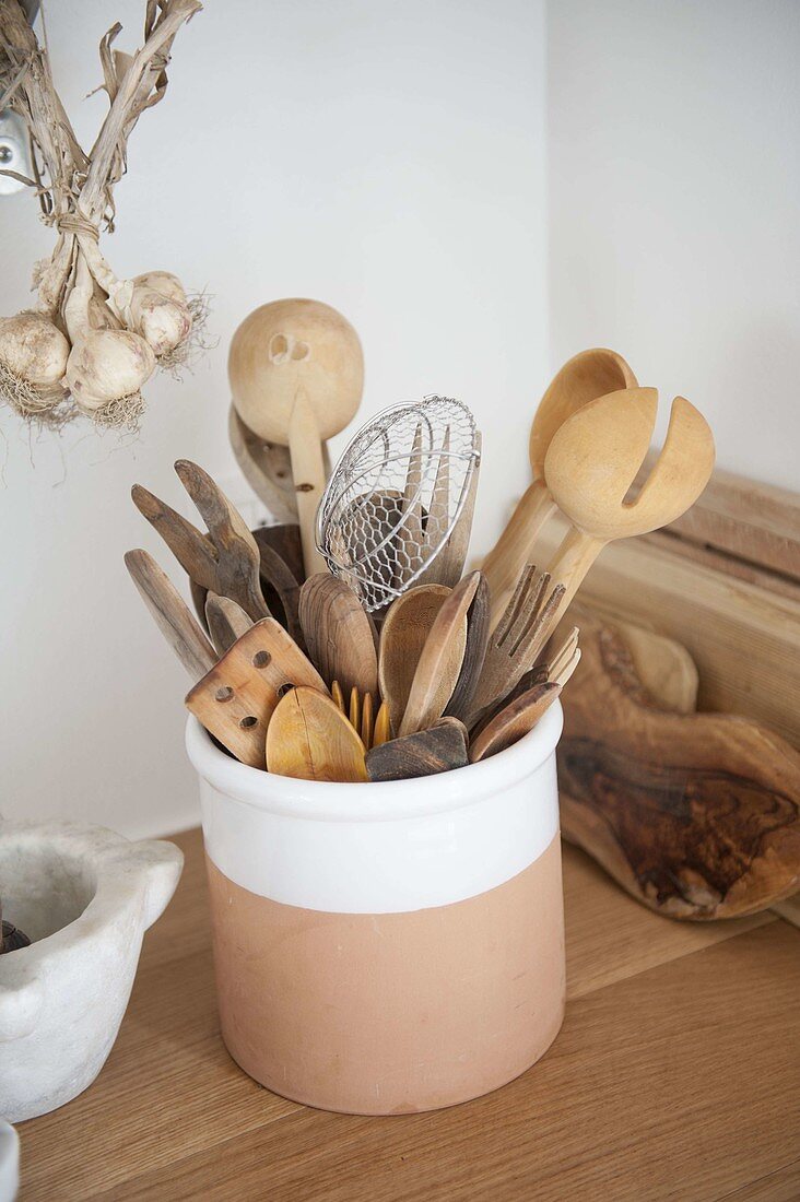 Kitchen utensils - various wooden spoons, forks and turners