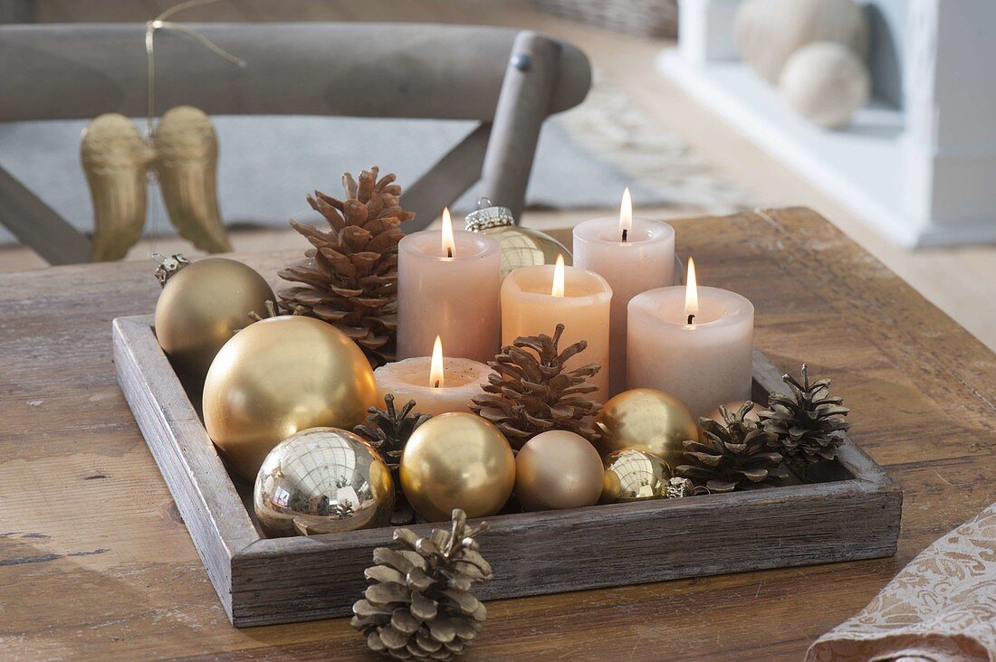 Simple Advent decoration with golden Christmas tree balls