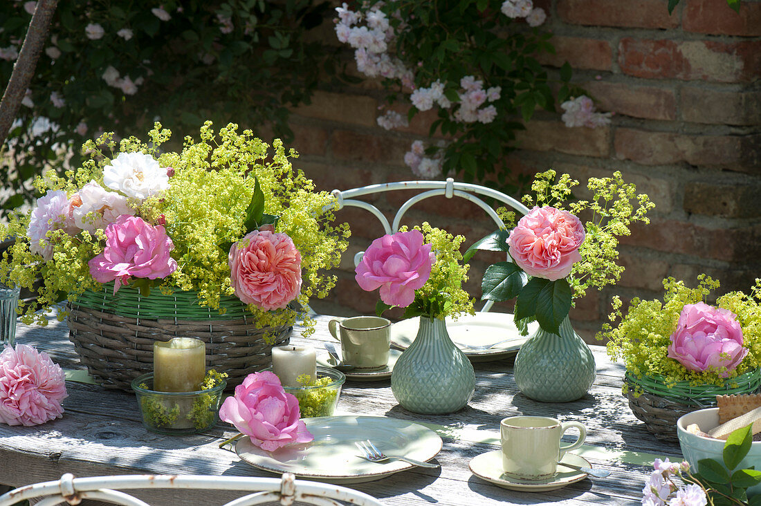 Table decoration with lady's mantle arrangement in the basket