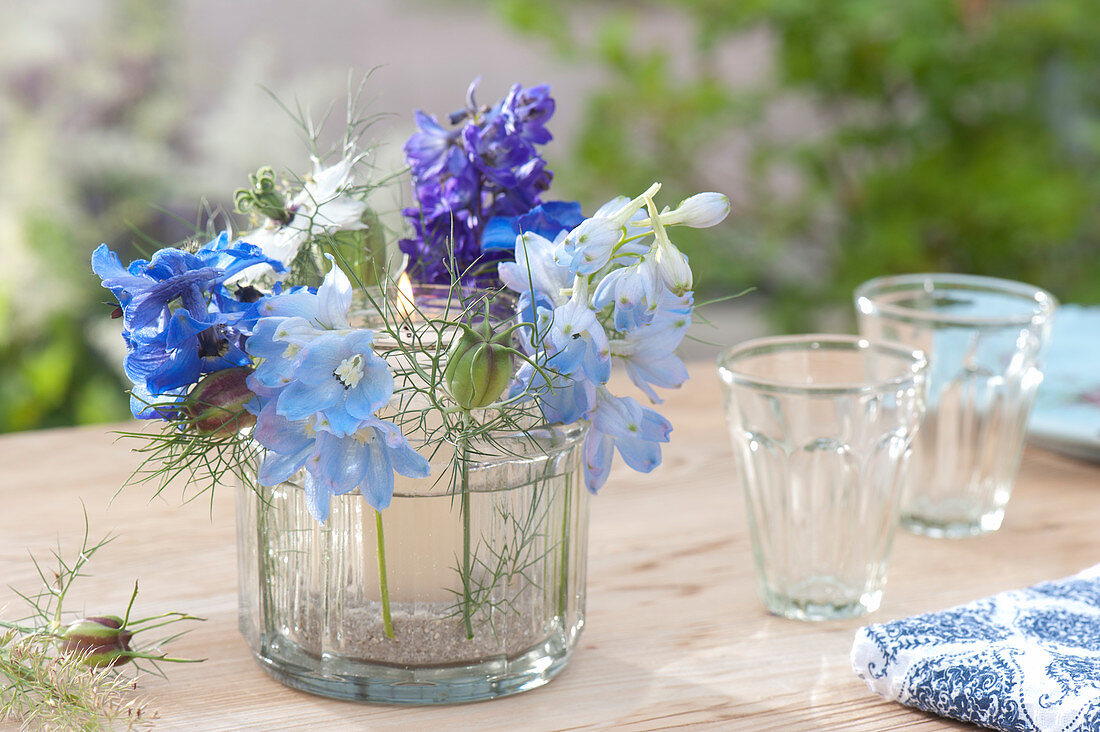 Glass in glass lantern with Delphinium (Larkspur) flowers