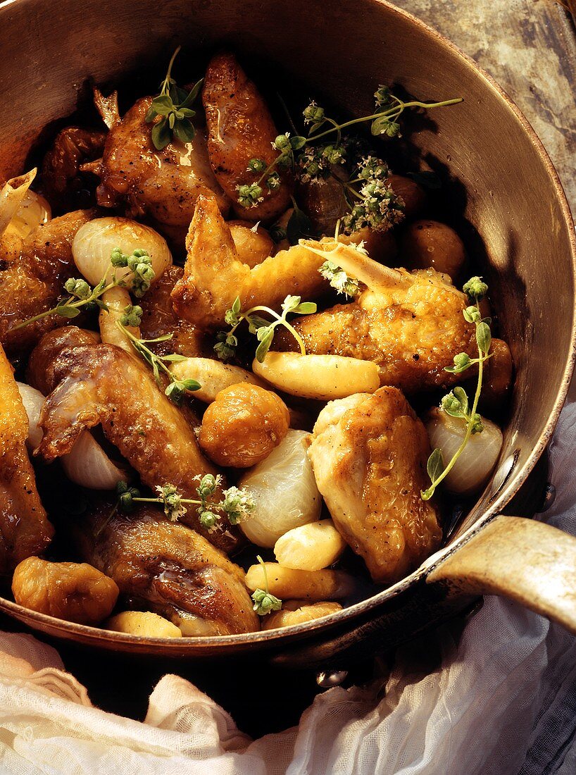 Guinea fowl with glazed pearl onions & chestnuts in pan