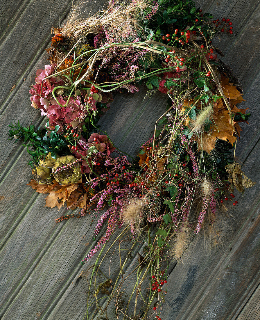 Door wreath of box, hydrangea, calluna, pennisetum, rosa multiflora