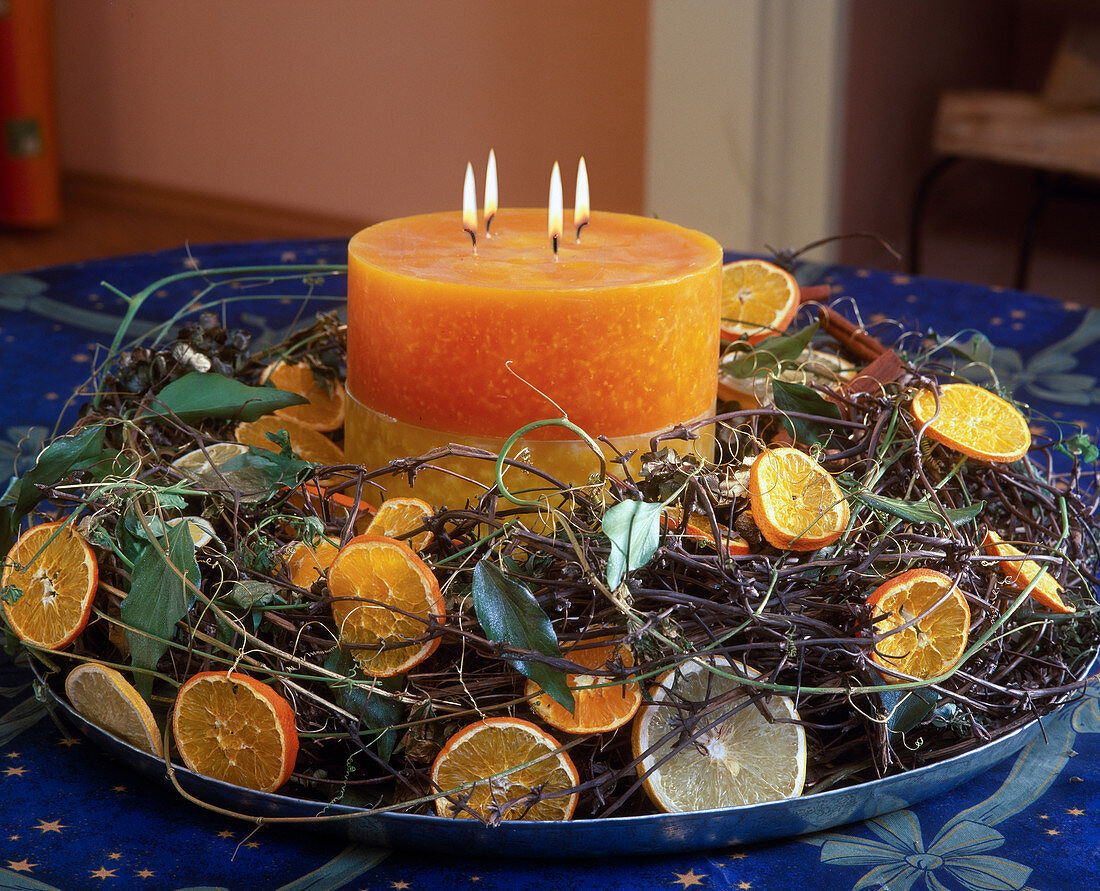 Advent wreath made of Clematis shoots, to wreath windings, lemons and orange slices