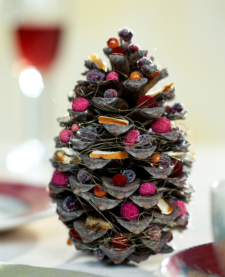 Blooming Christmas pine cones. Pine cones filled with various Christmassy material
