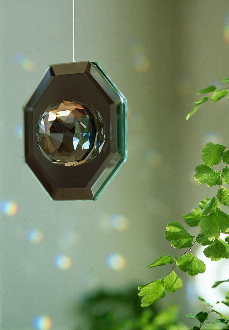 Octagonal mirror with attached glass ball