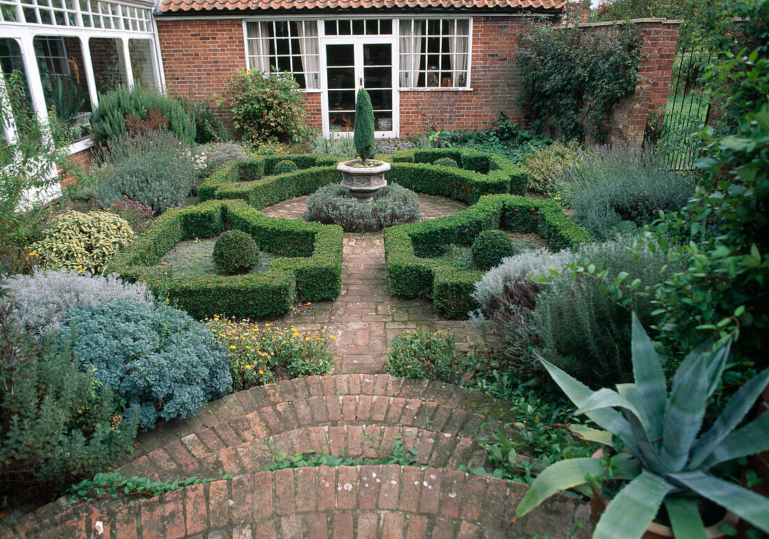 Classic formal courtyard with buxus (box hedge) and herbs