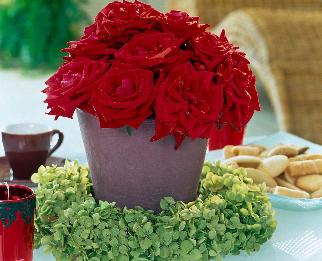 Red roses, sedum (stonecrop), wreath of hydrangea