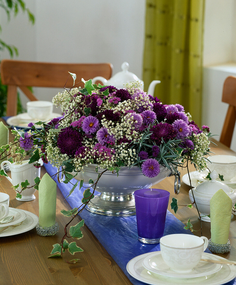 Table decoration with Callistephus (summer aster), Aster 'Marie Ballard', lavender branch