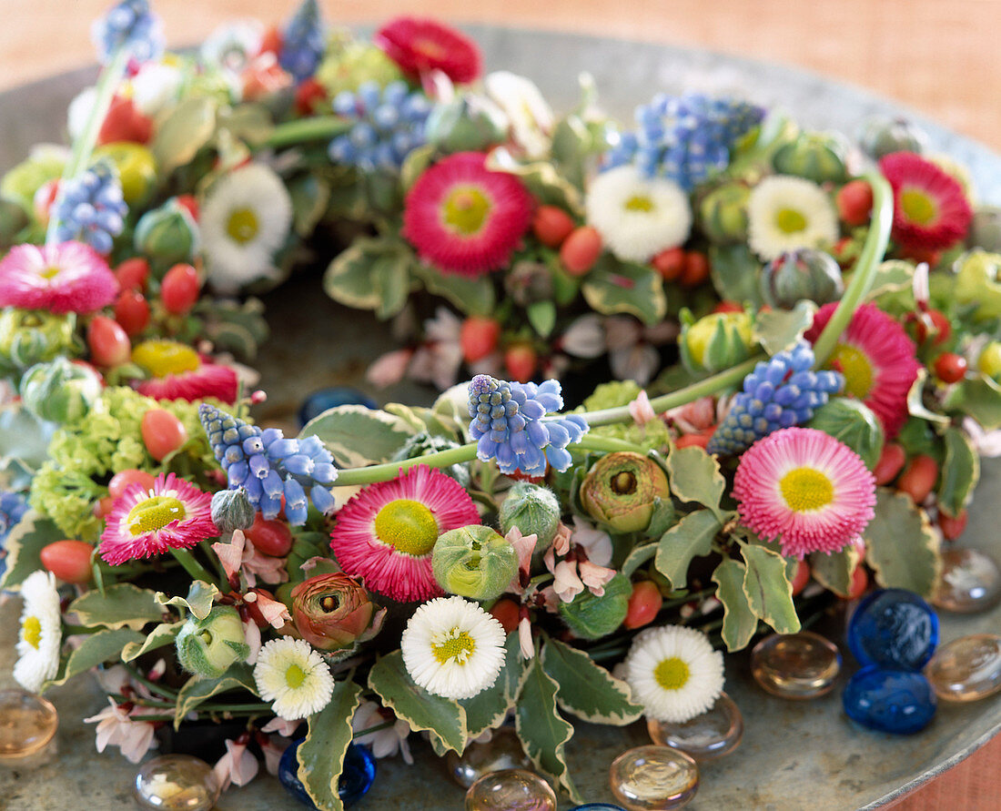 Spring heart with daisies and grape hyacinths