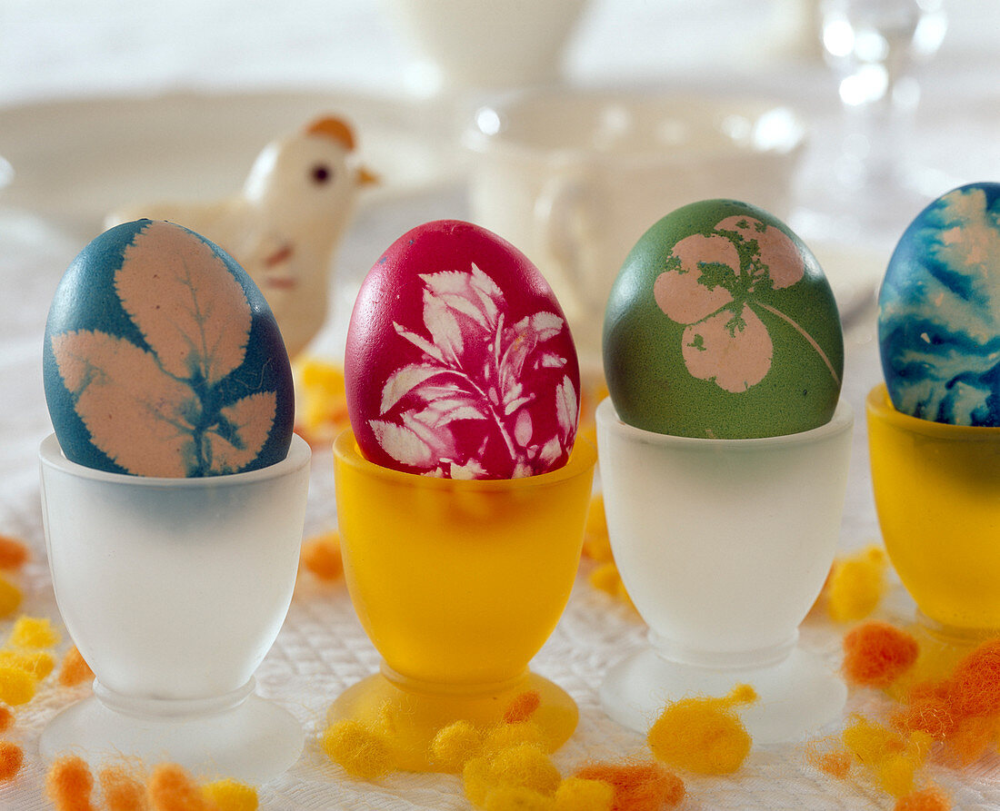 Colored easter eggs with leaf impression