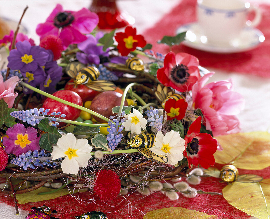 Wreath with spring flowers as Easter nest