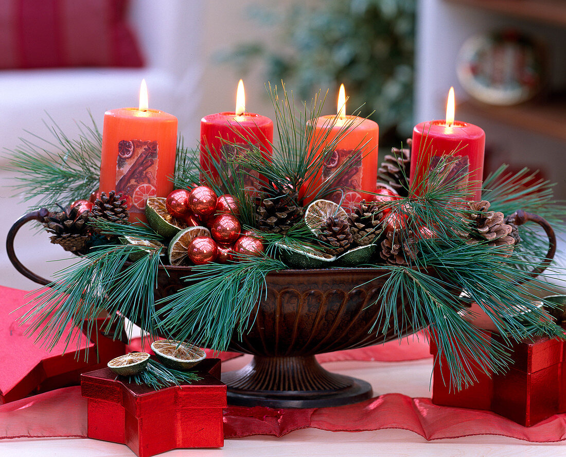 Advent arrangement in iron jardiniere with branches and candles