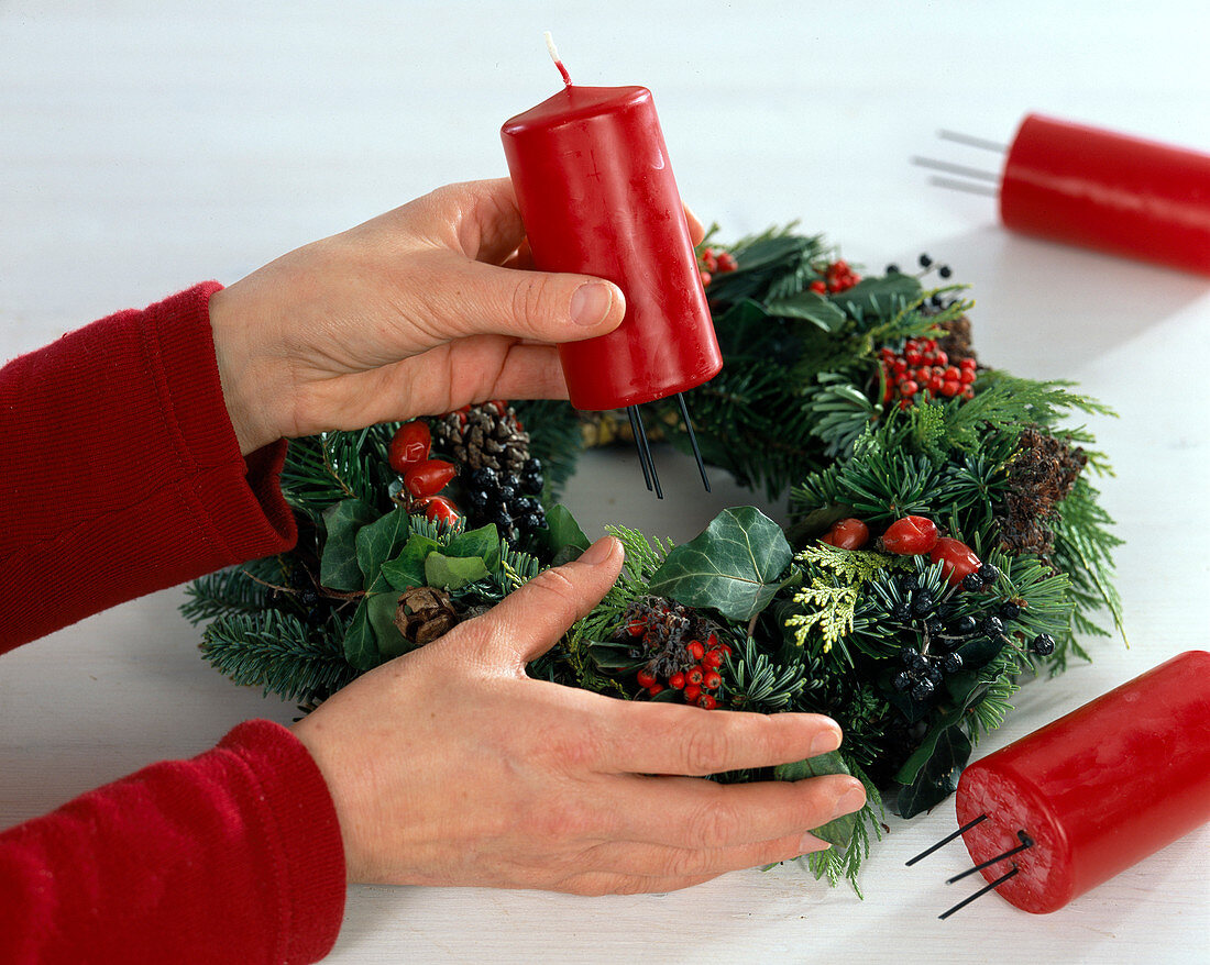 Fixing candles on an Advent wreath