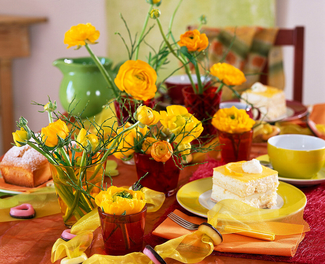 Table decoration with yellow ranunculus