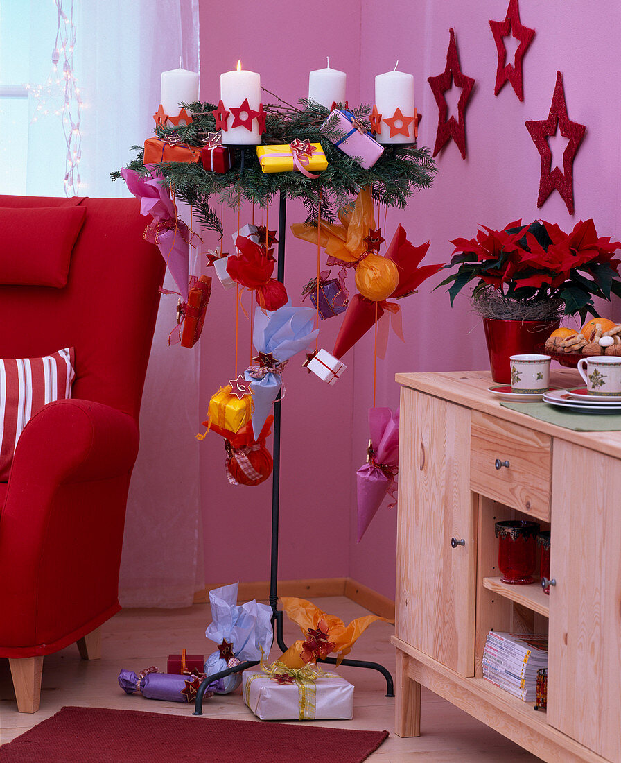 Wreath of Picea (spruce), Larix (larch), candles with wooden stars, metal stand