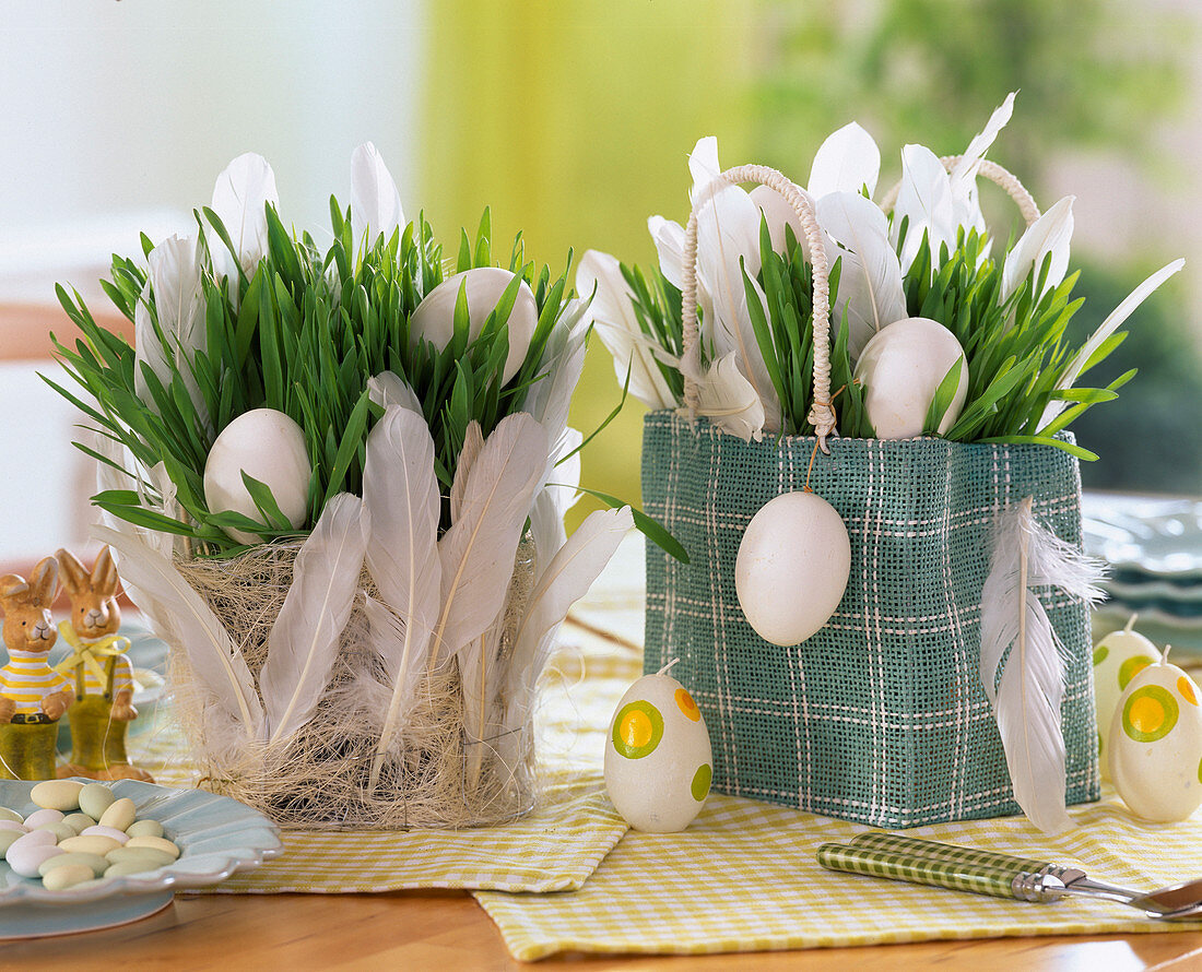 Wheatgrass with eggs and feathers in burlap bag and sisal basket