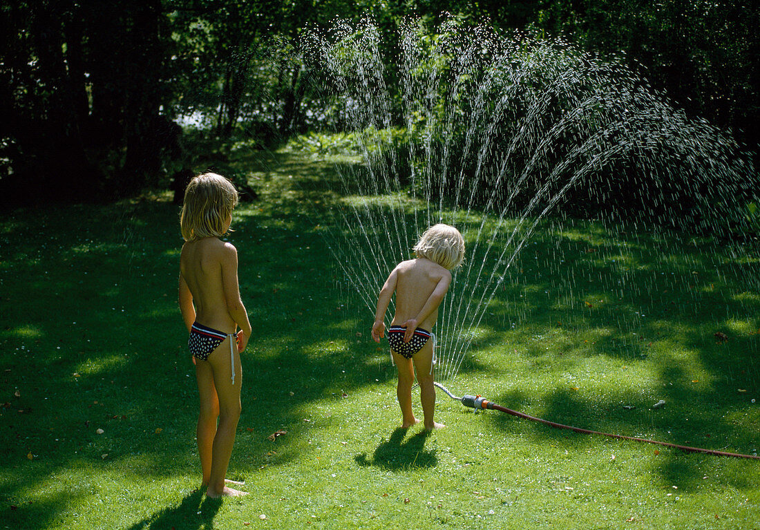 Lawn sprinkled with children