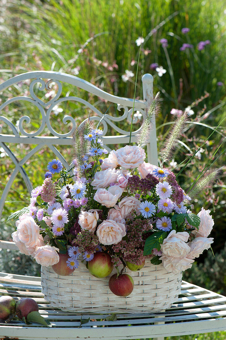 Autumn arrangement of pink (rose), aster (asters), sedum