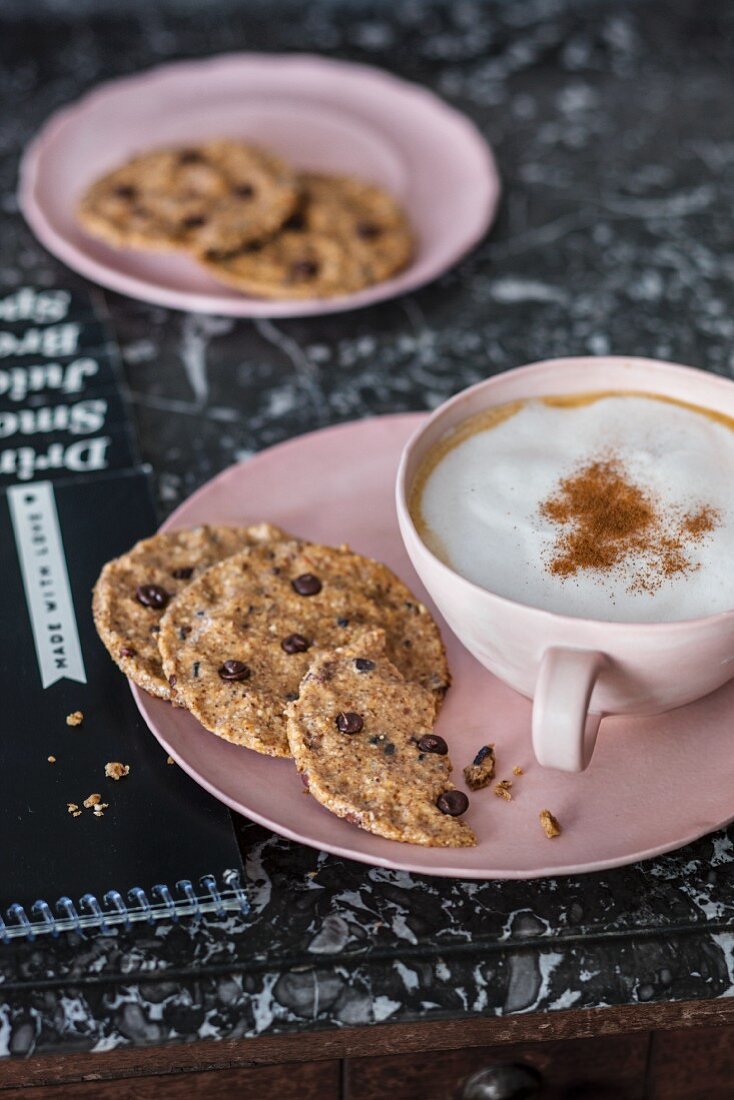 Vegan chocolate chip cookies and a cappuccino