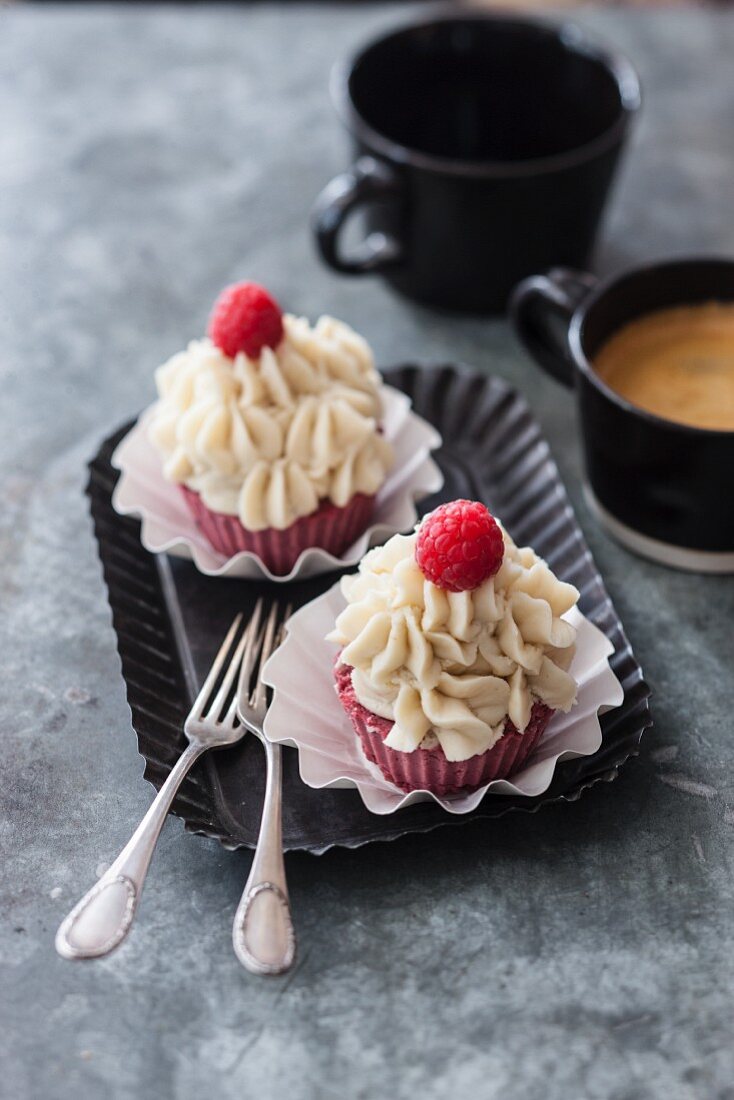 Vegan beetroot cupcakes with raspberries and vanilla frosting