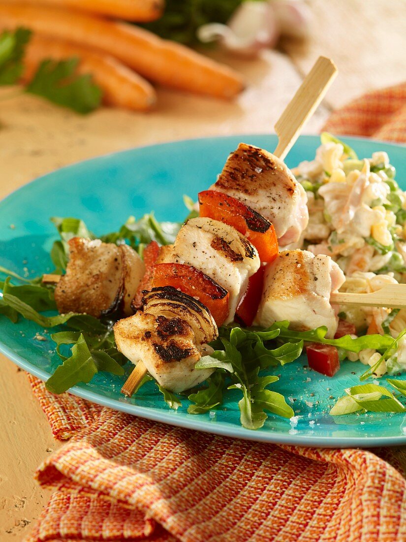 Pasta salad with chicken skewers