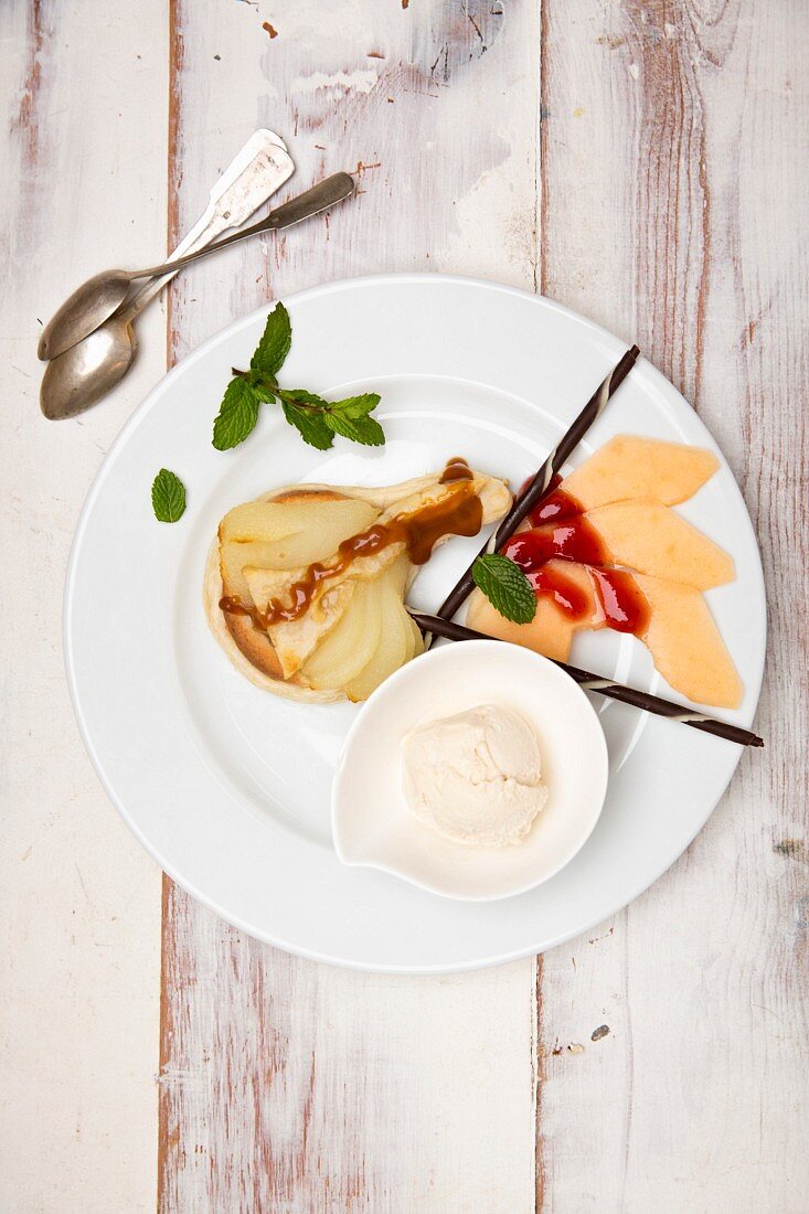 Pear tart with melon and vanilla ice cream