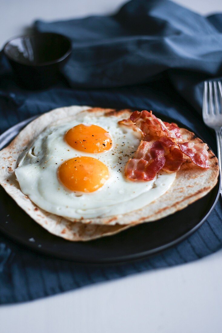 Breakfast tortilla with bacon and egg