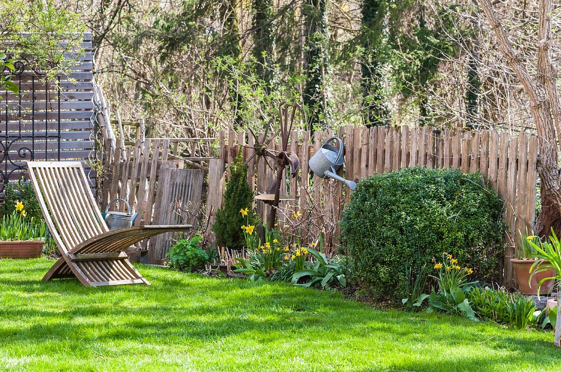 Flowerbed and lawn in idyllic garden