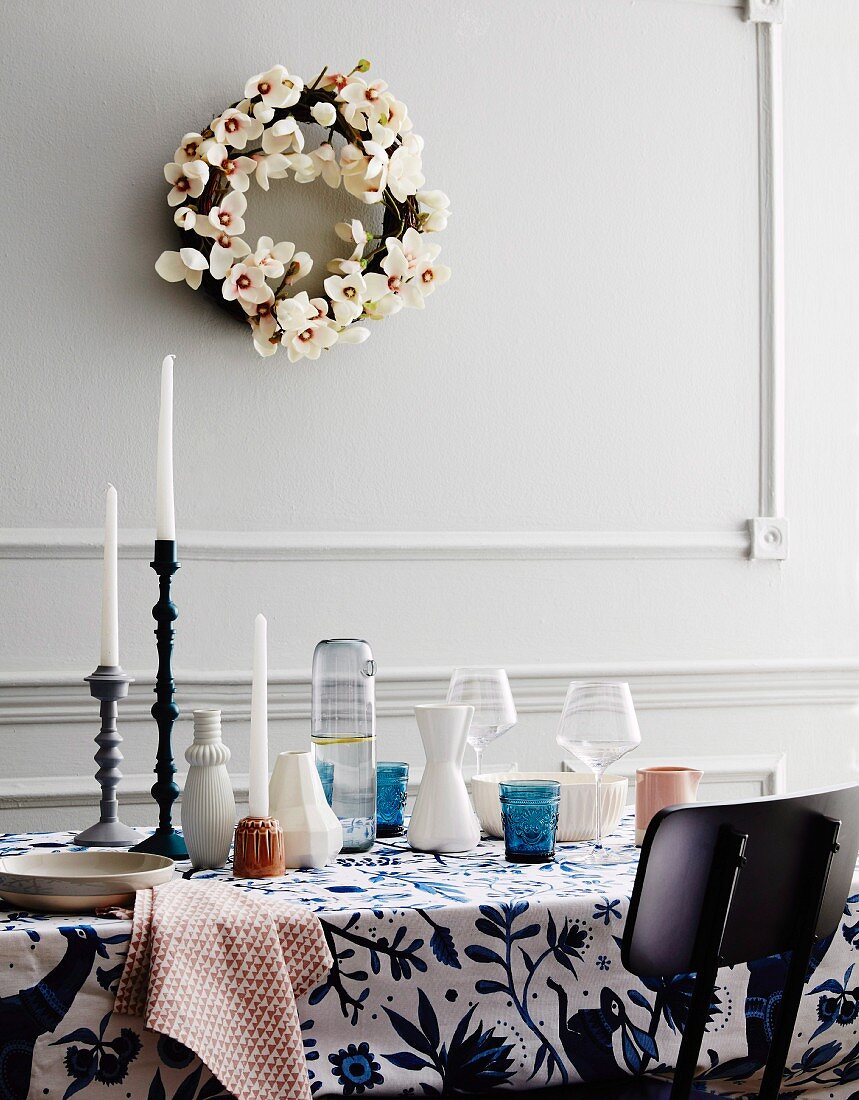 Wreath of orchid flowers over table with various dishes