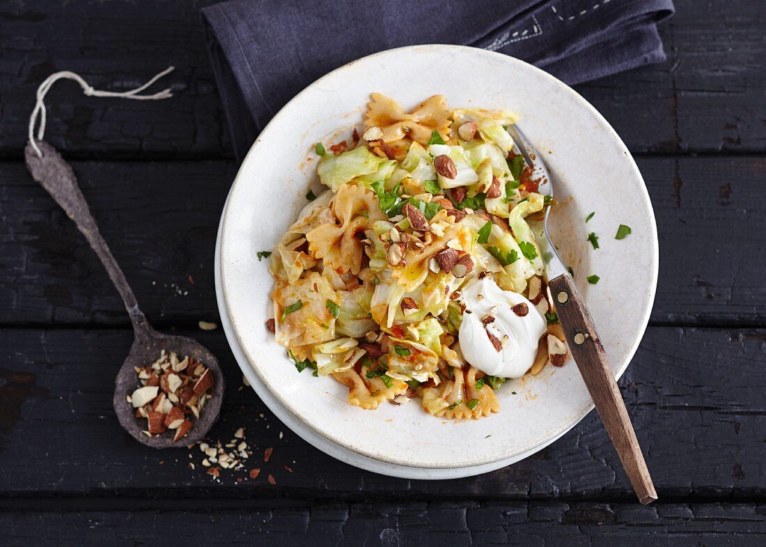 Farfalle with paprika, cabbage and smoked almonds (vegetarian)