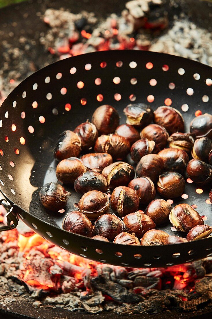 Chestnuts being roasted on an open fire