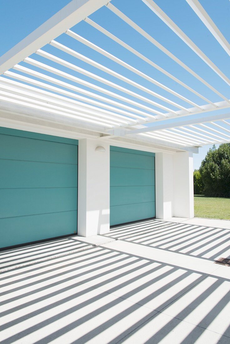Rectilinear architecture and pattern of light and shadow outside garages