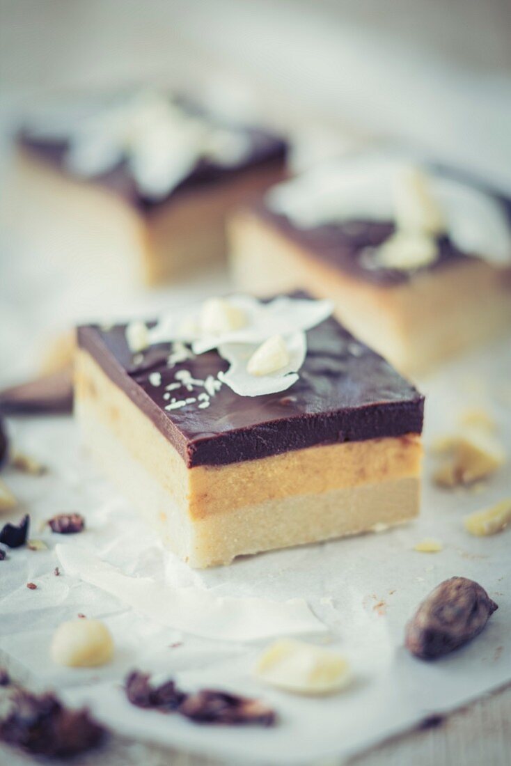 Coconut and caramel cake slices with chocolate