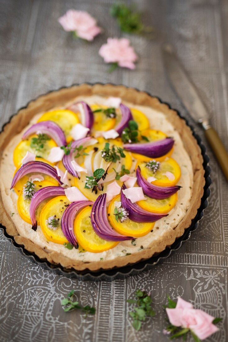A courgette tart with red onions
