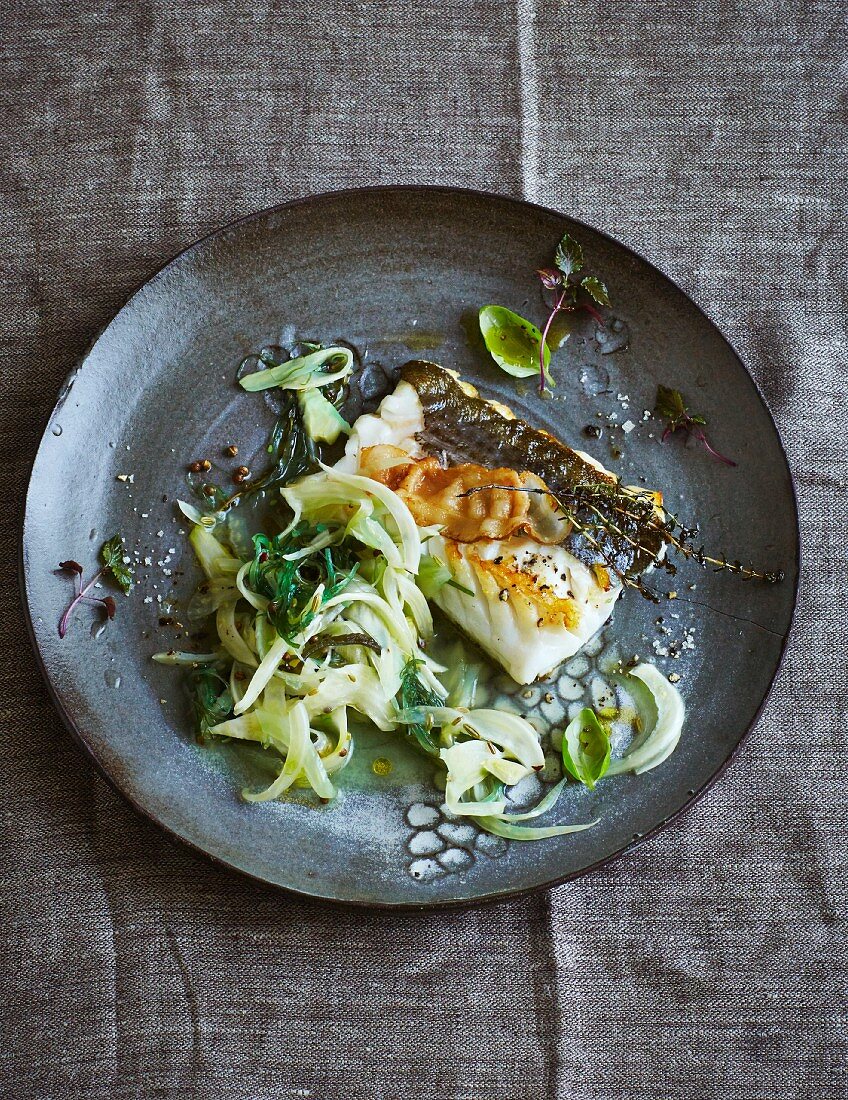 Skrei cod fillet with lardo on a bed of fennel with wakame (low carb)
