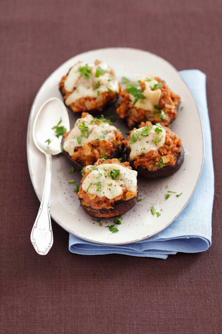 Baked portobello mushrooms stuffed with meat and cheese