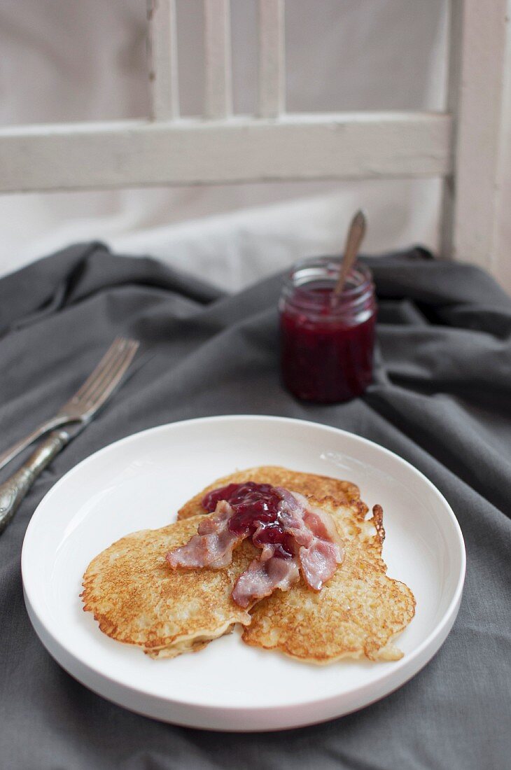 Raggmunk is traditional Swedish potato pancake, fried in butter, served with fried pork and lingonberries
