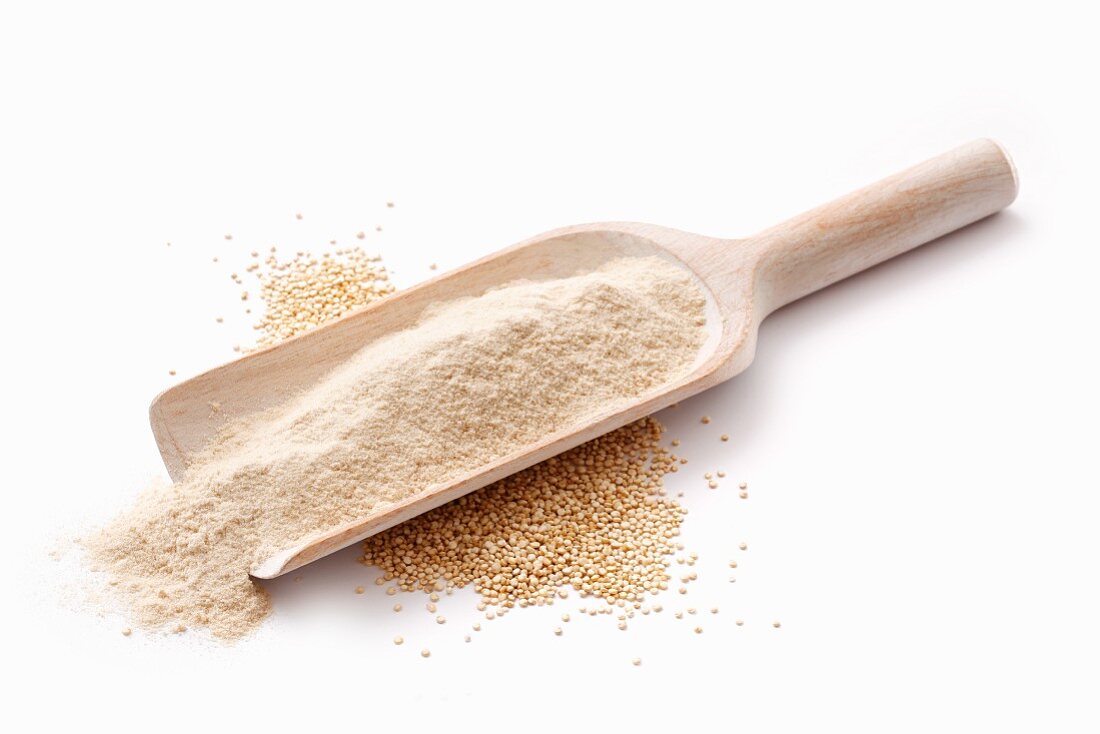 Amaranth flour in a wooden scoop