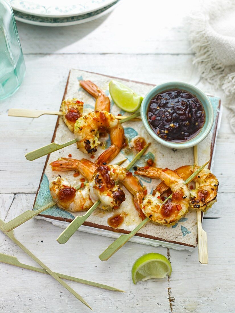Grilled prawns marinated with lime, ginger and garlic with home made sweet chilli sauce,