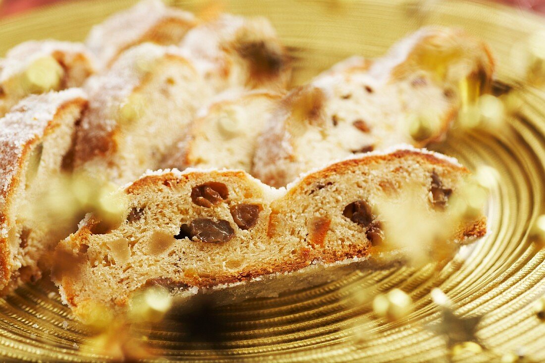 Christmas stollen on a gold plate