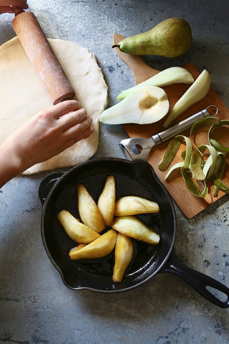 Preparing pear tarte tatin