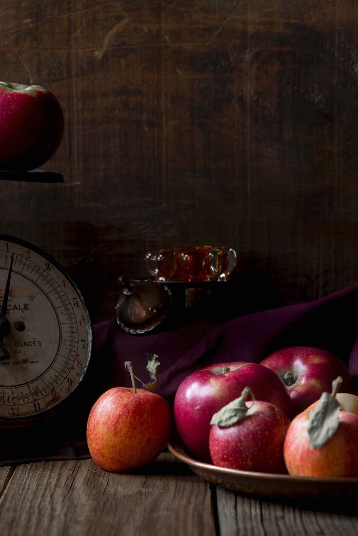 Red apples in a vintage setting with scales