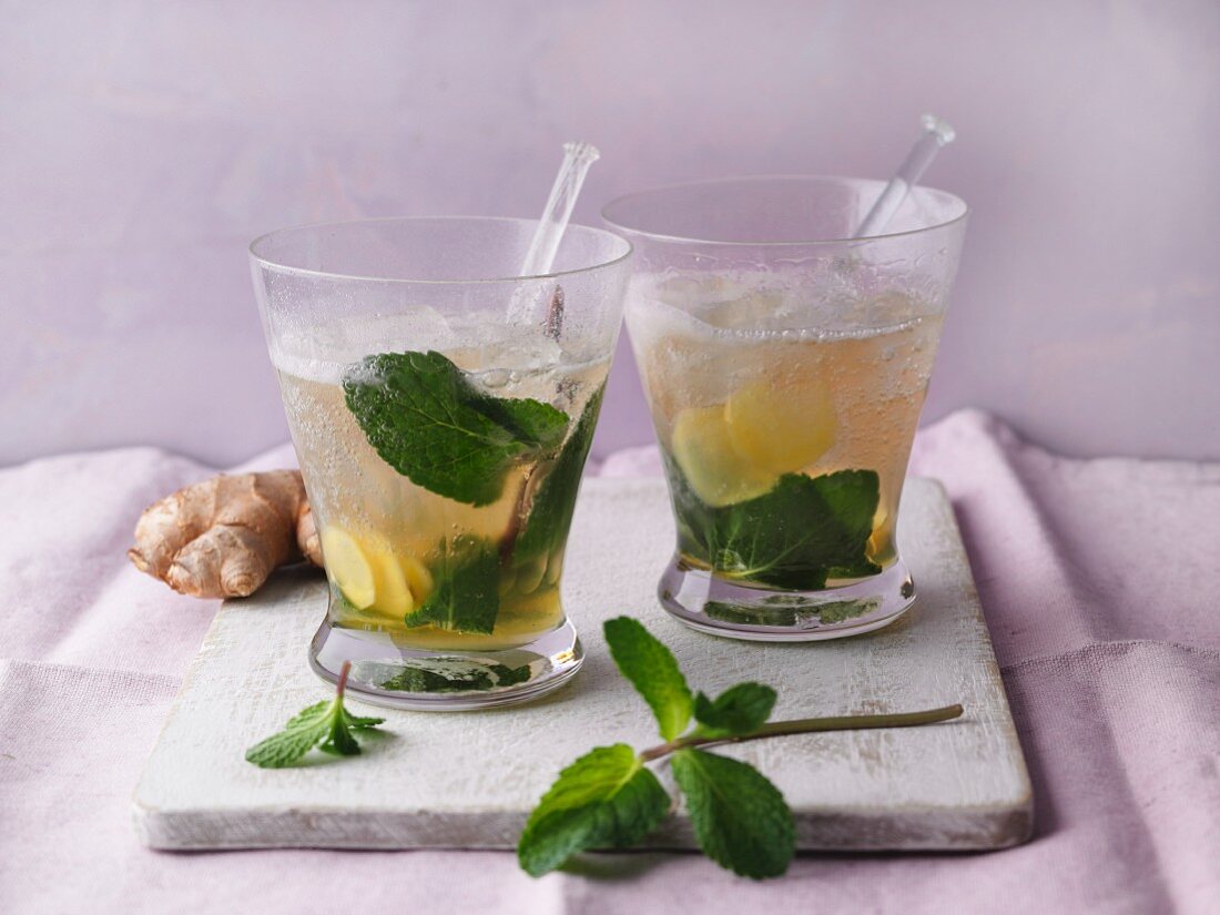 Orange and ginger cocktail with mint and ginger ale