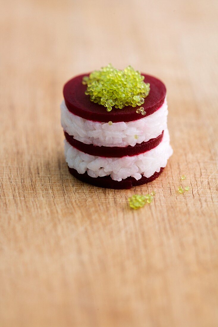 Red beet sushi with caviar