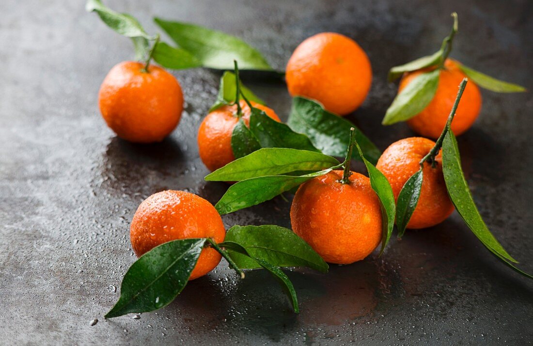 Several tangerines with leaves