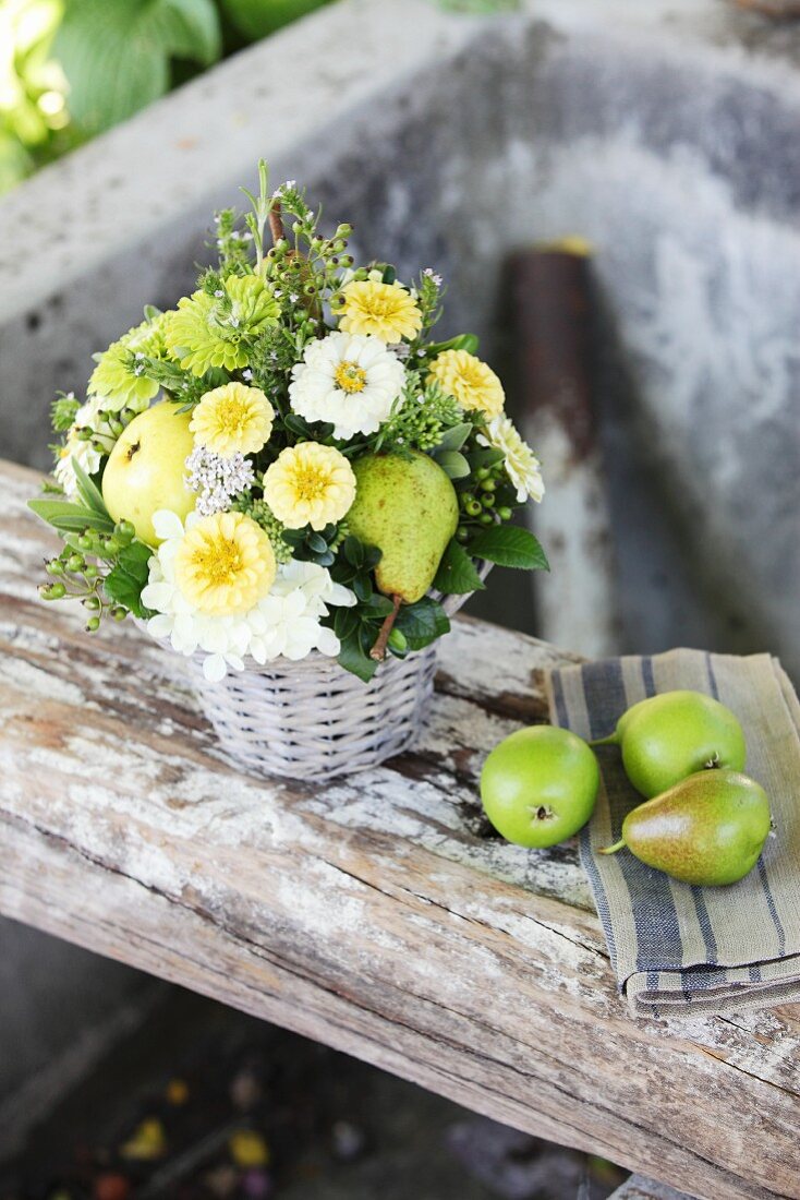 Arrangement of zinnias, hydrangeas and pears