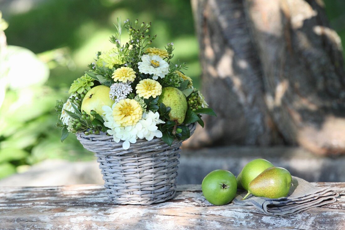 Arrangement of zinnias, hydrangeas and pears