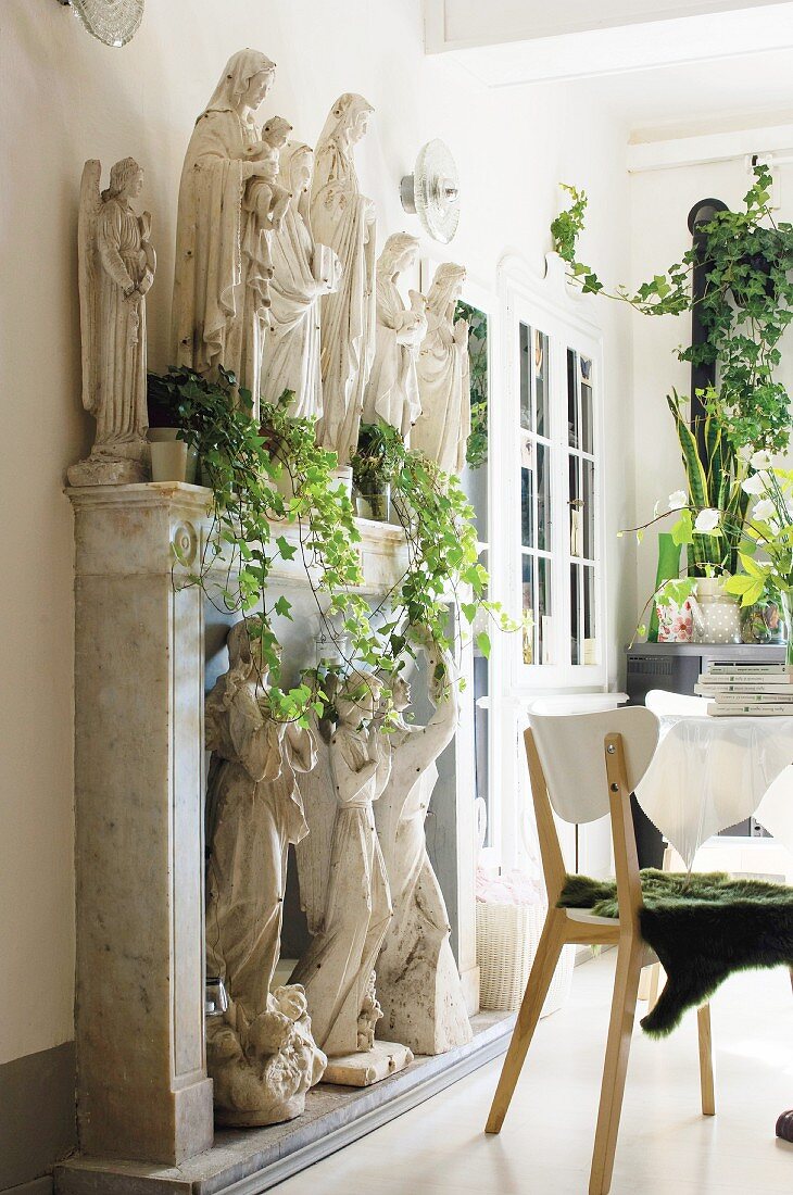 Collection of sculptures on mantlepiece in dining room